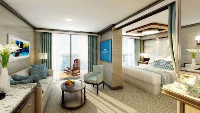 Att bo i en svit kan ge din kryssning guldkant. Bilden visar en svit från Princess Cruises. Man ser en soffa med stor tv framför, på andra sidan väggen ser man en dubbelsäng och ut genom fönstret en vacker balkong.